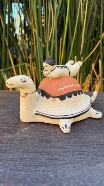 Small Pottery Figurine Boy on a Turtle