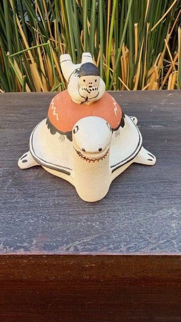 Small Pottery Figurine Boy on a Turtle